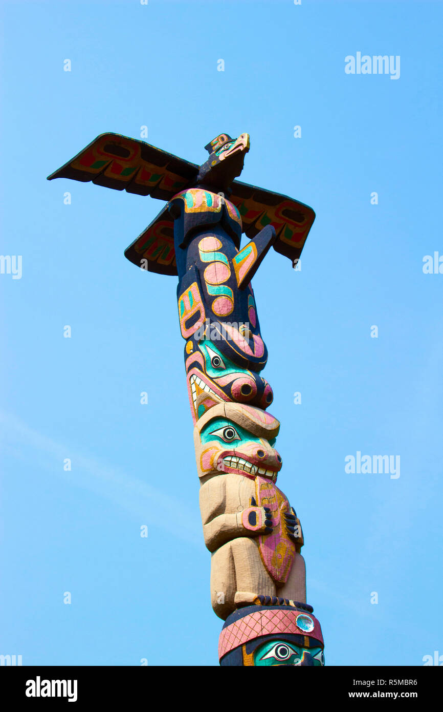 Totem Pole in Canada, blue sky background Stock Photo - Alamy