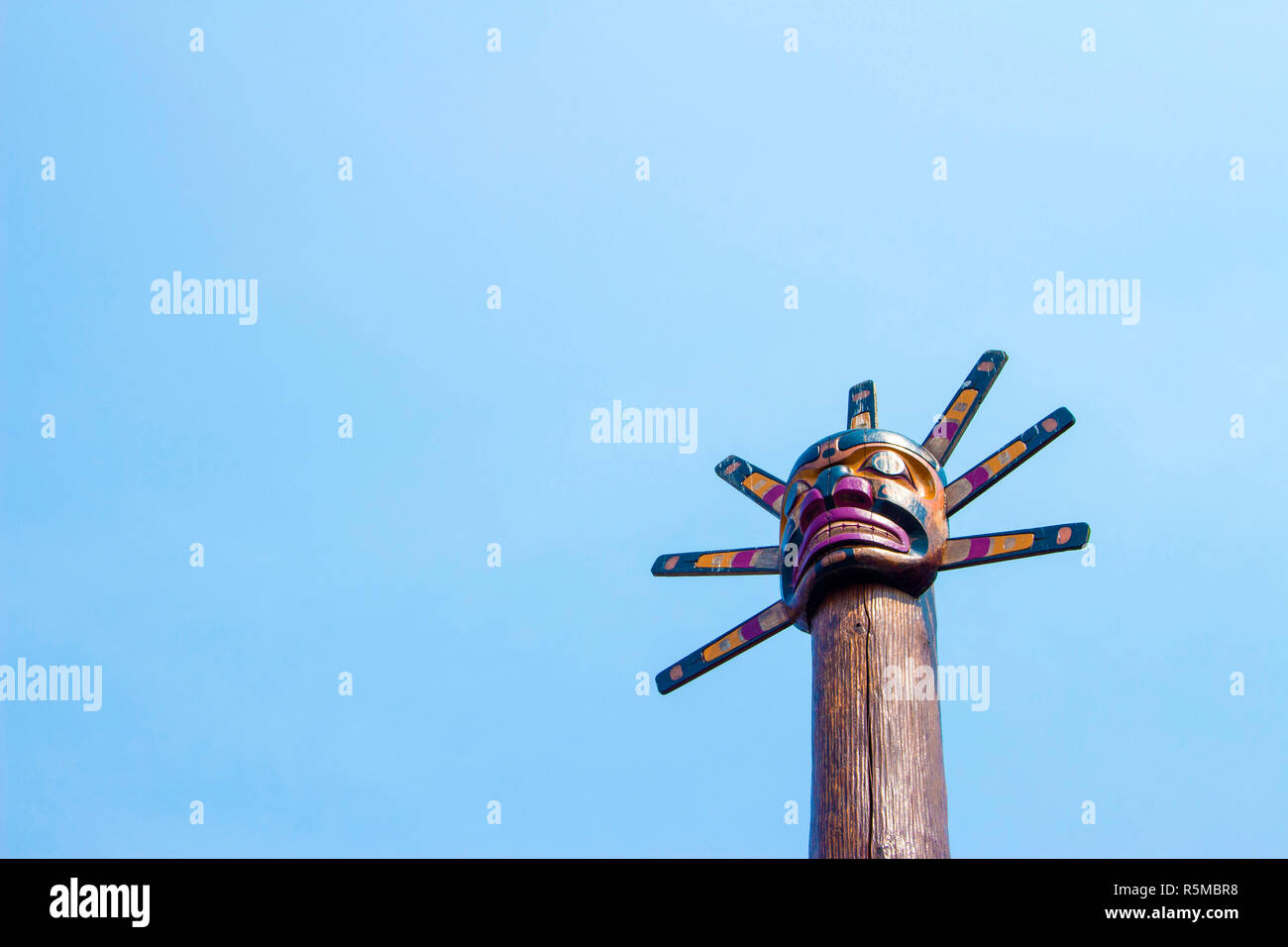 Totem Pole in Canada, blue sky background Stock Photo - Alamy