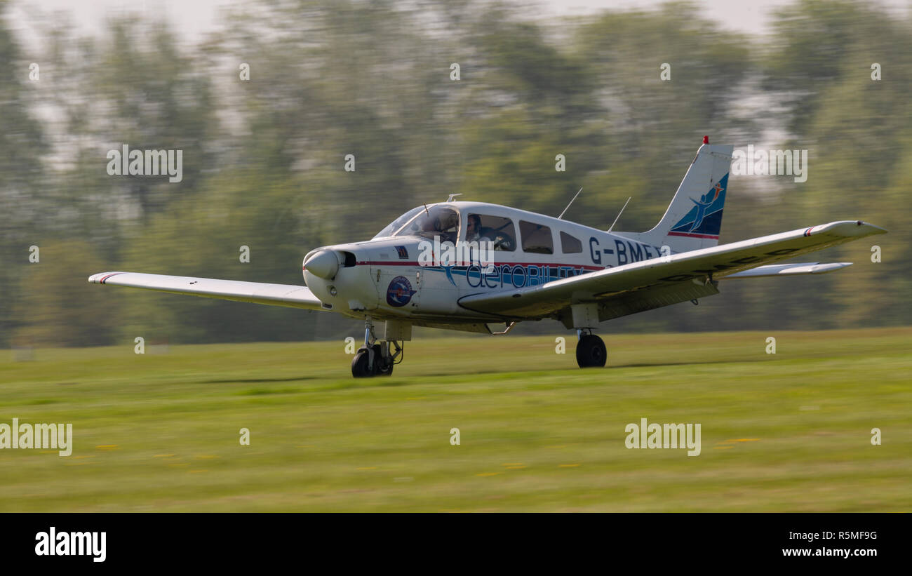 Biggleswade, UK - 6th May 2018: Piper PA-28 Warrior belonging to the charity aerobility, lands at airfield Stock Photo