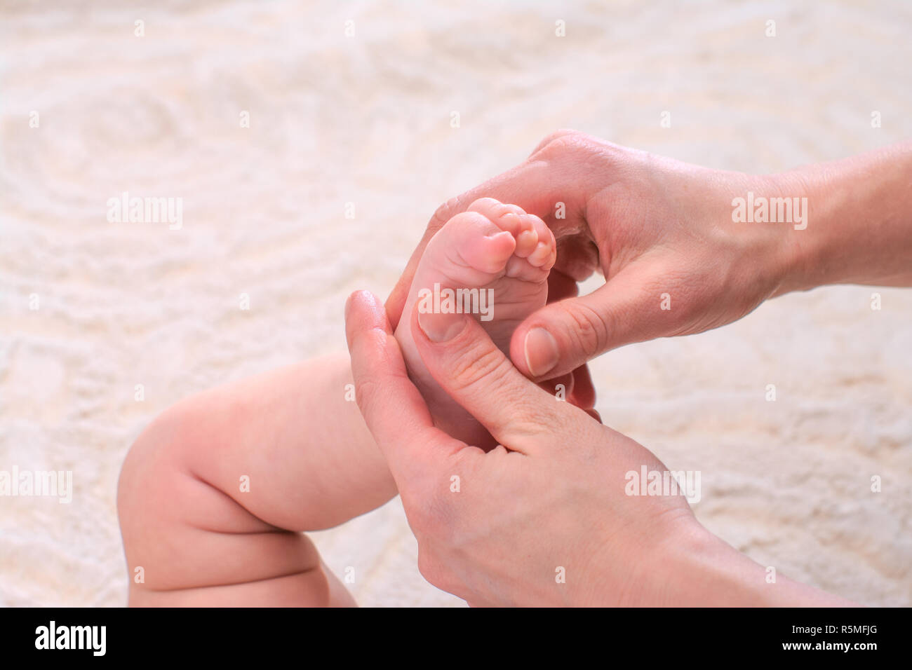 Child foot massage hires stock photography and images Alamy