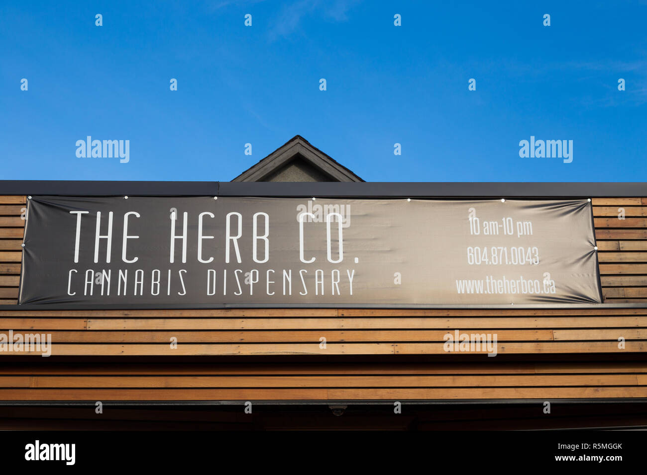 VANCOUVER, BC, CANADA - NOV 29, 2018: Signage outside a Vancouver dispensary on Kingsway Ave in the month following marijuana legalization in Canada. Stock Photo