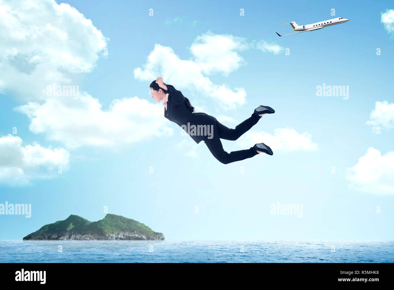 Business woman jumping from airplane Stock Photo Alamy