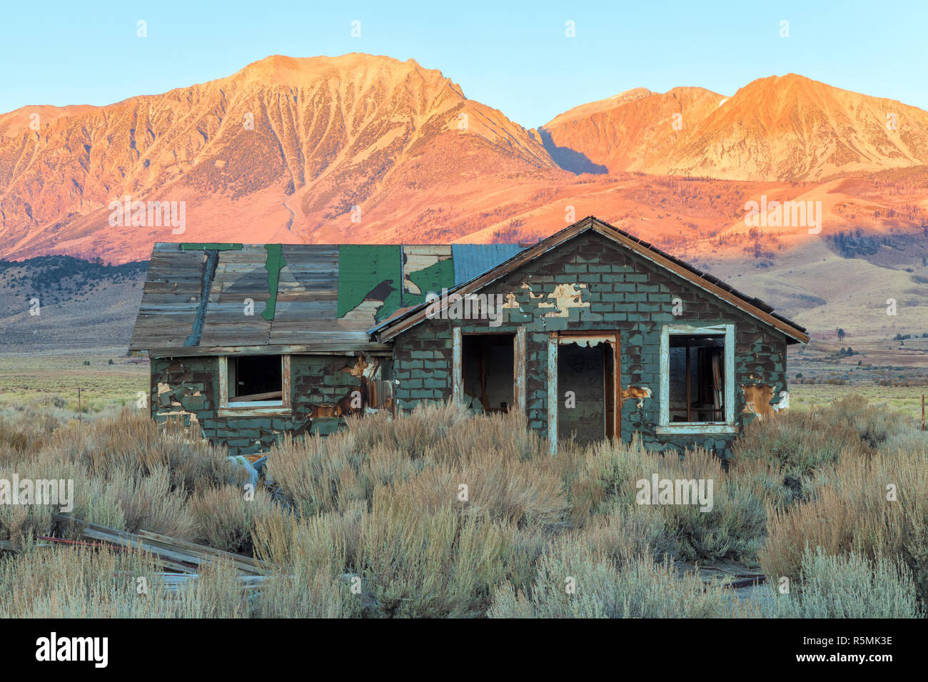 A deserted house among the sagebrushes at early autumn morning, Eastern Sierra Nevada Mountains, California, United States. Stock Photo