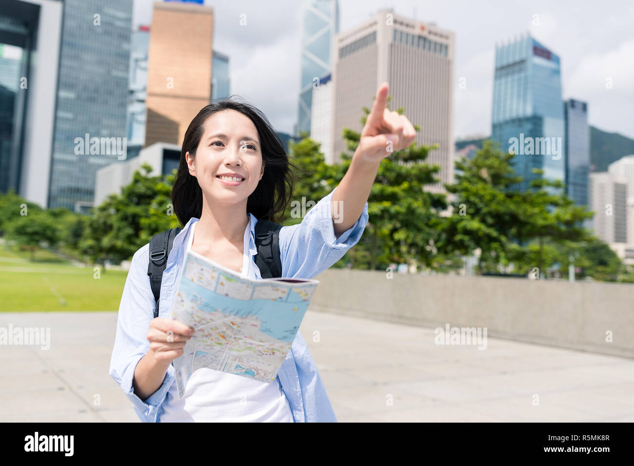 Woman using city map in Hong Kong Stock Photo - Alamy