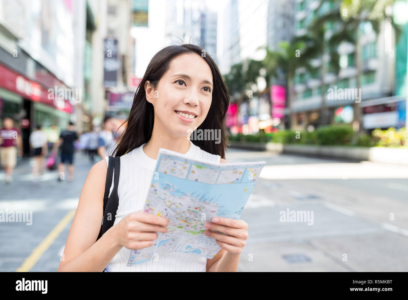 Woman travel in Hong Kong and using city map Stock Photo - Alamy