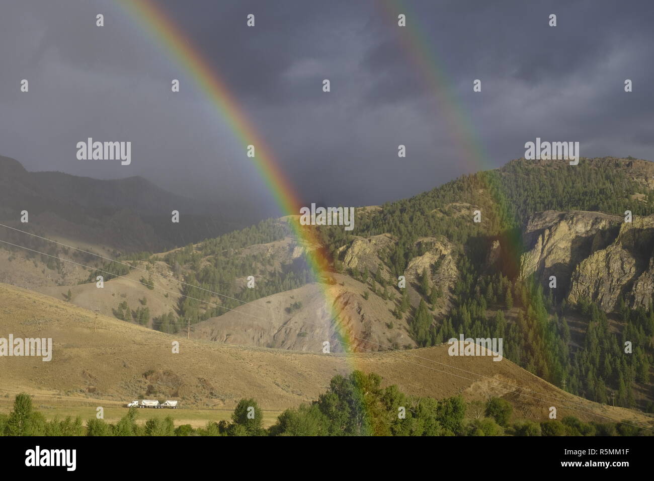 Rainbow and double rainbow over the mountains in central Idaho Stock Photo