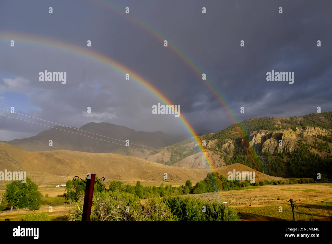 Rainbow and double rainbow over the mountains in Central Idaho Stock