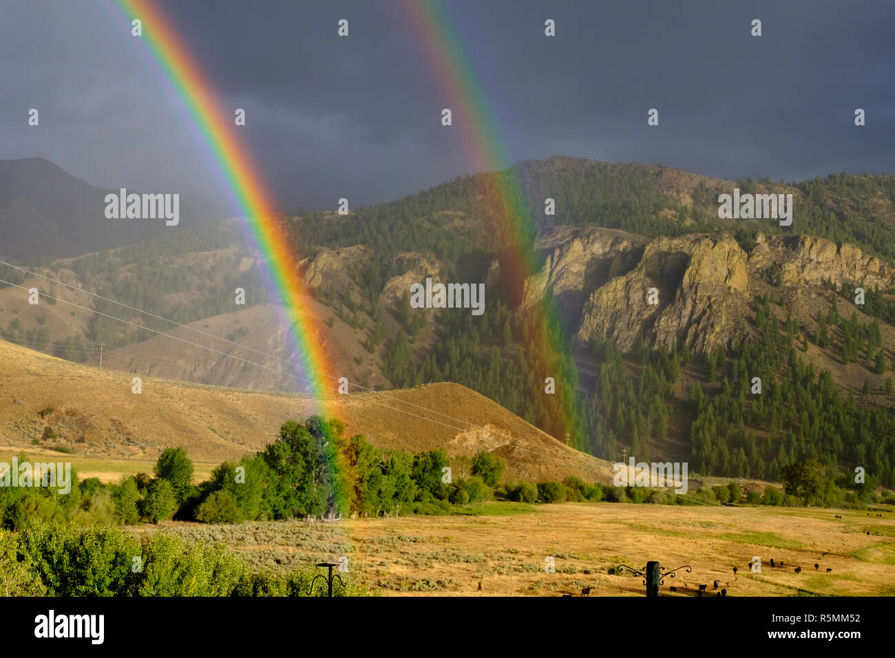 Rainbow and double rainbow over the mountains in Central Idaho Stock