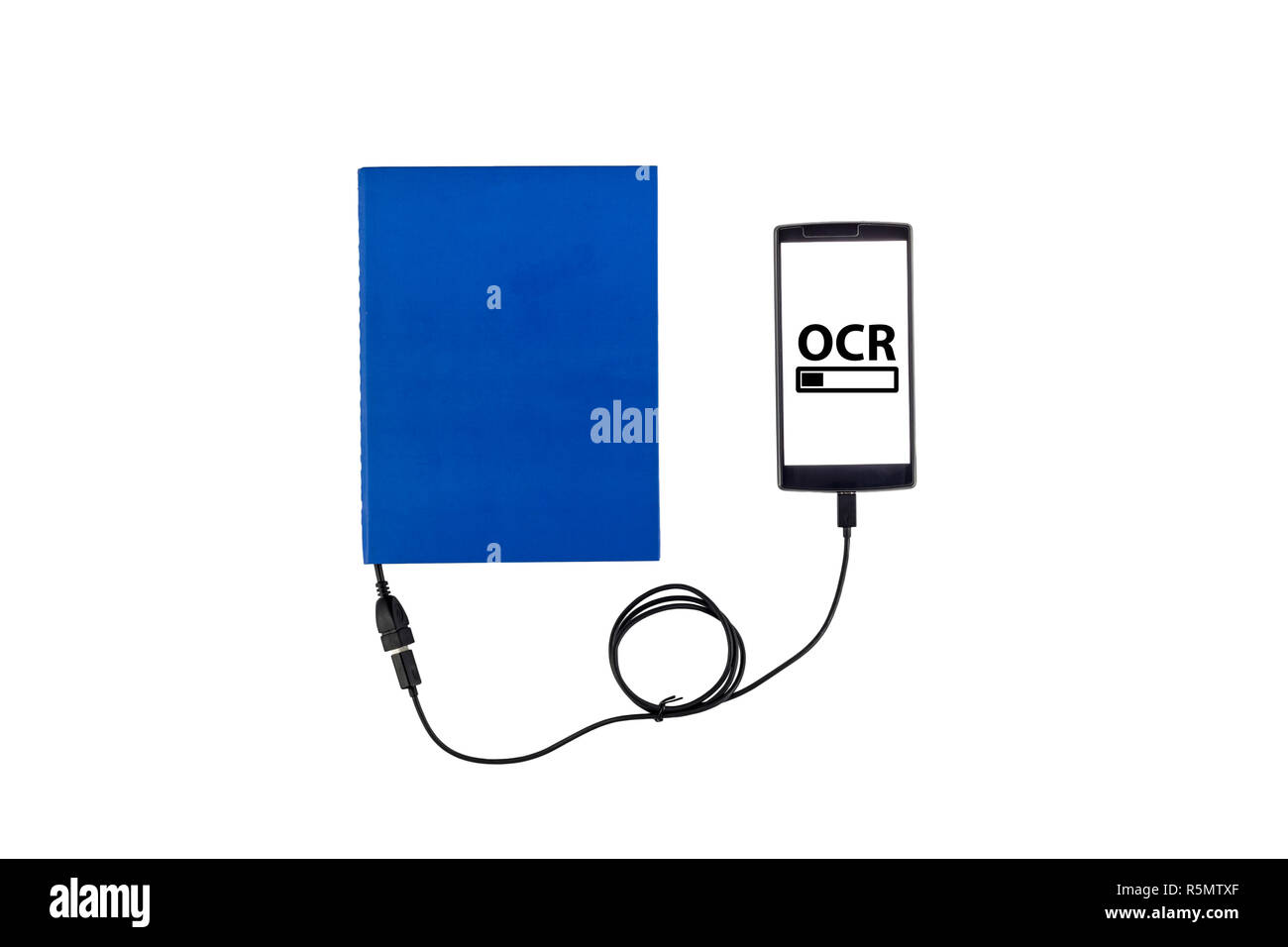 Book connected to a smartphone through an USB cable. Optical character recognition loading bar. Stock Photo