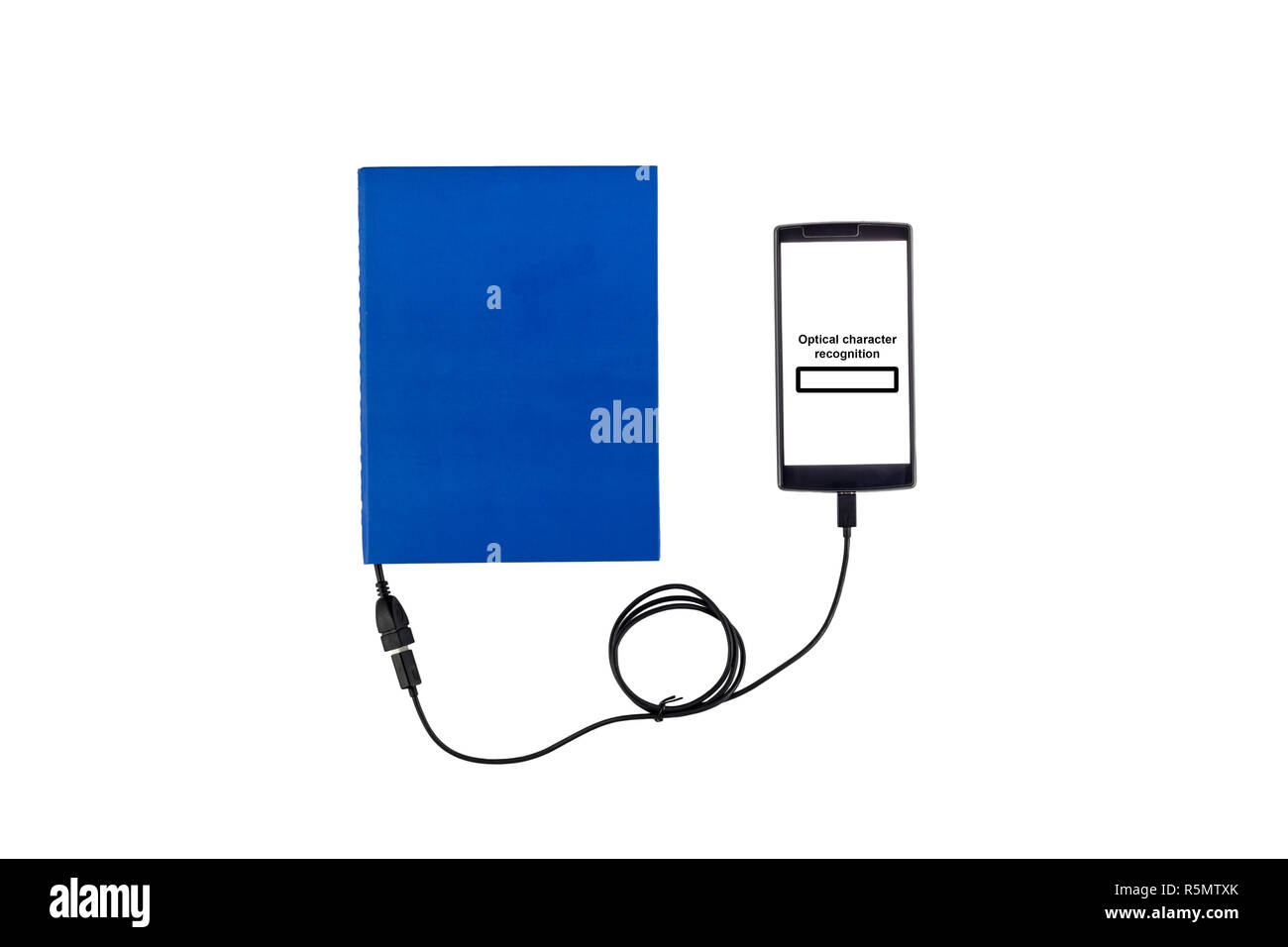 Book connected to a smartphone through an USB cable. Optical character recognition loading bar. Stock Photo