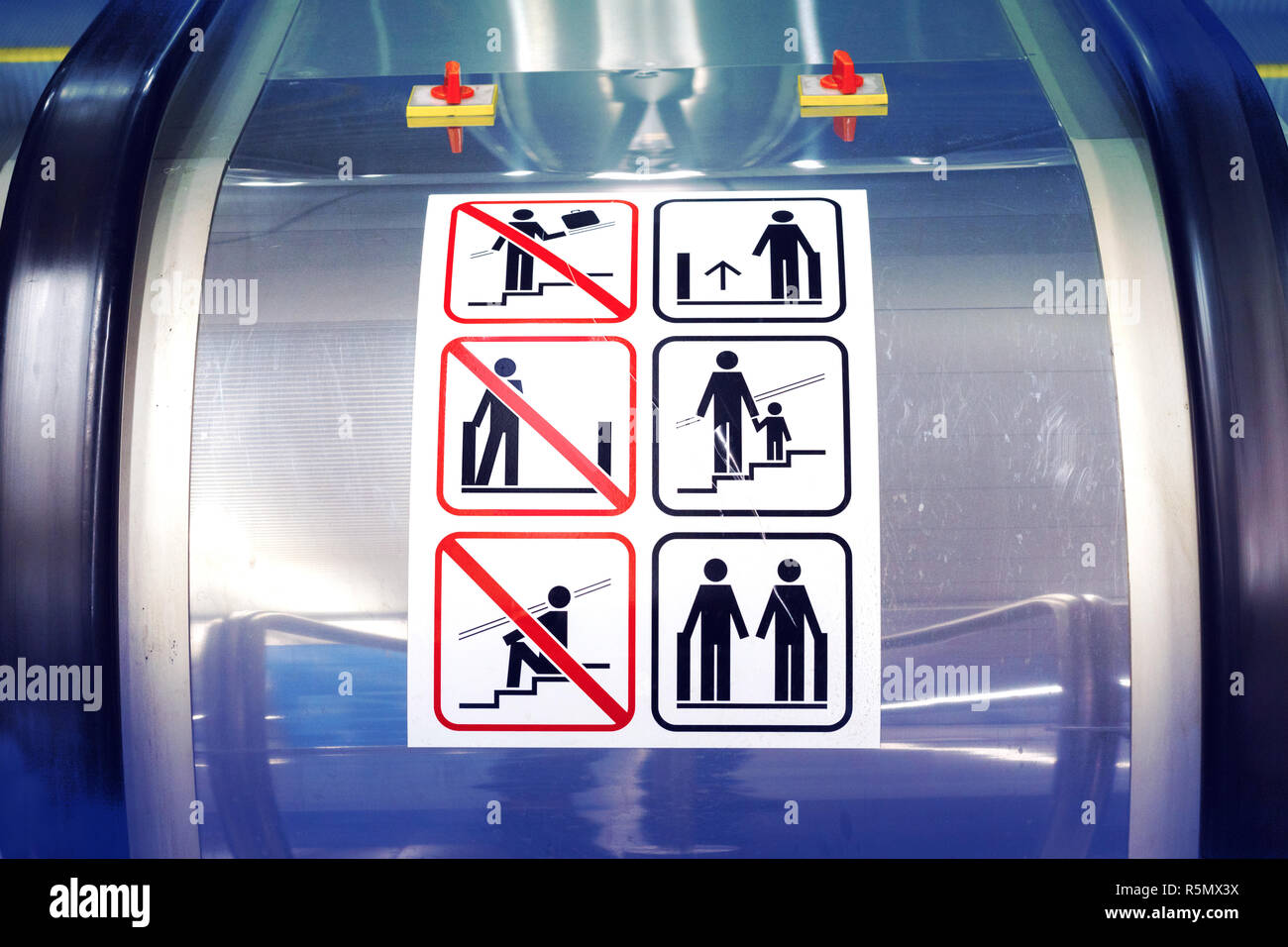 Signs on the escalator. Warning signs on the escalator in the metro Stock Photo