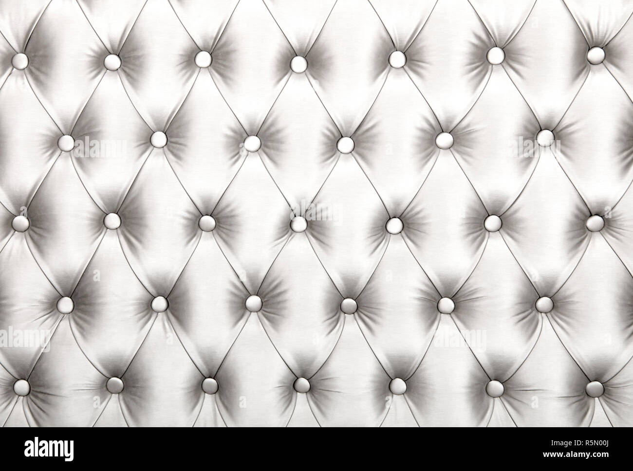 White capitone tufted fabric upholstery texture Stock Photo - Alamy