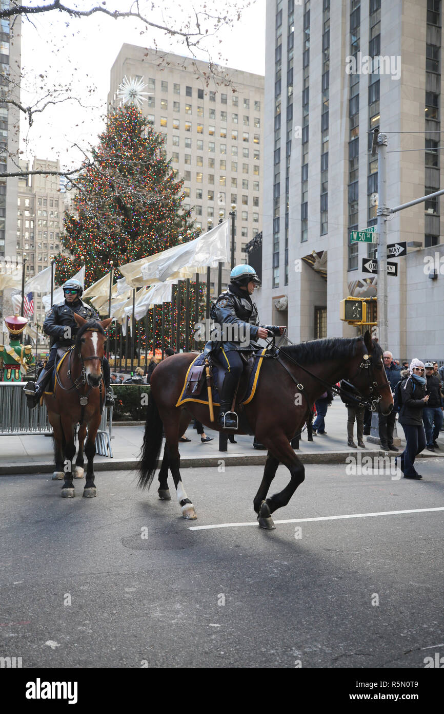 NYPD Mounted Unit police officer provides security at Rockefeller Plaza in Midtown Manhattan Stock Photo