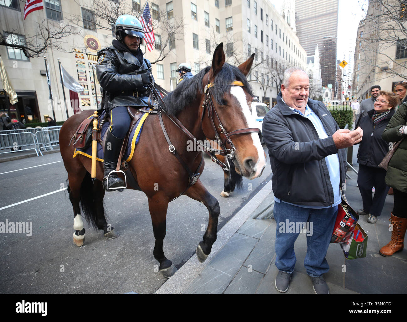 NYPD Mounted Unit police officer provides security at Rockefeller Plaza