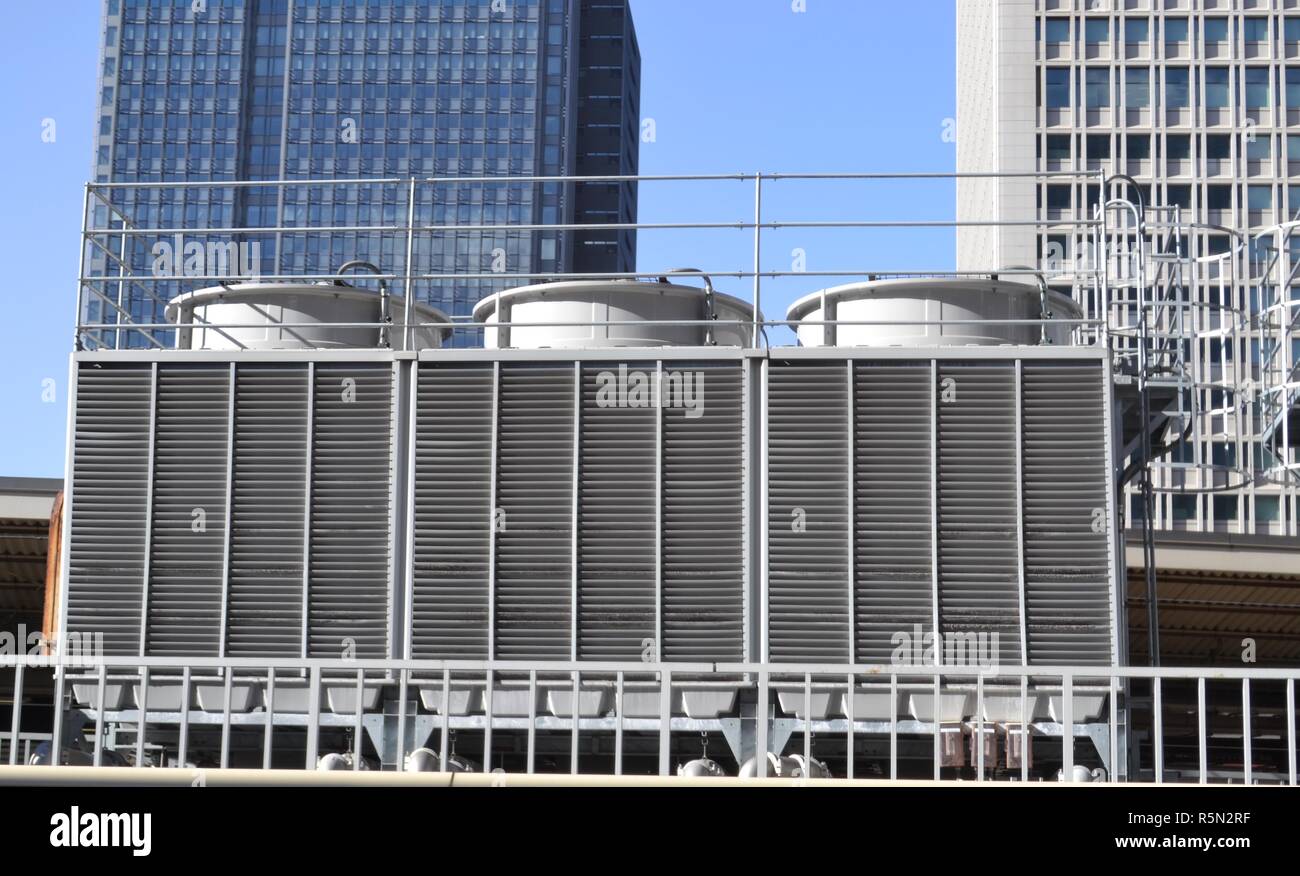 Cooling tower HVAC services on a building rooftop in Tokyo Stock Photo