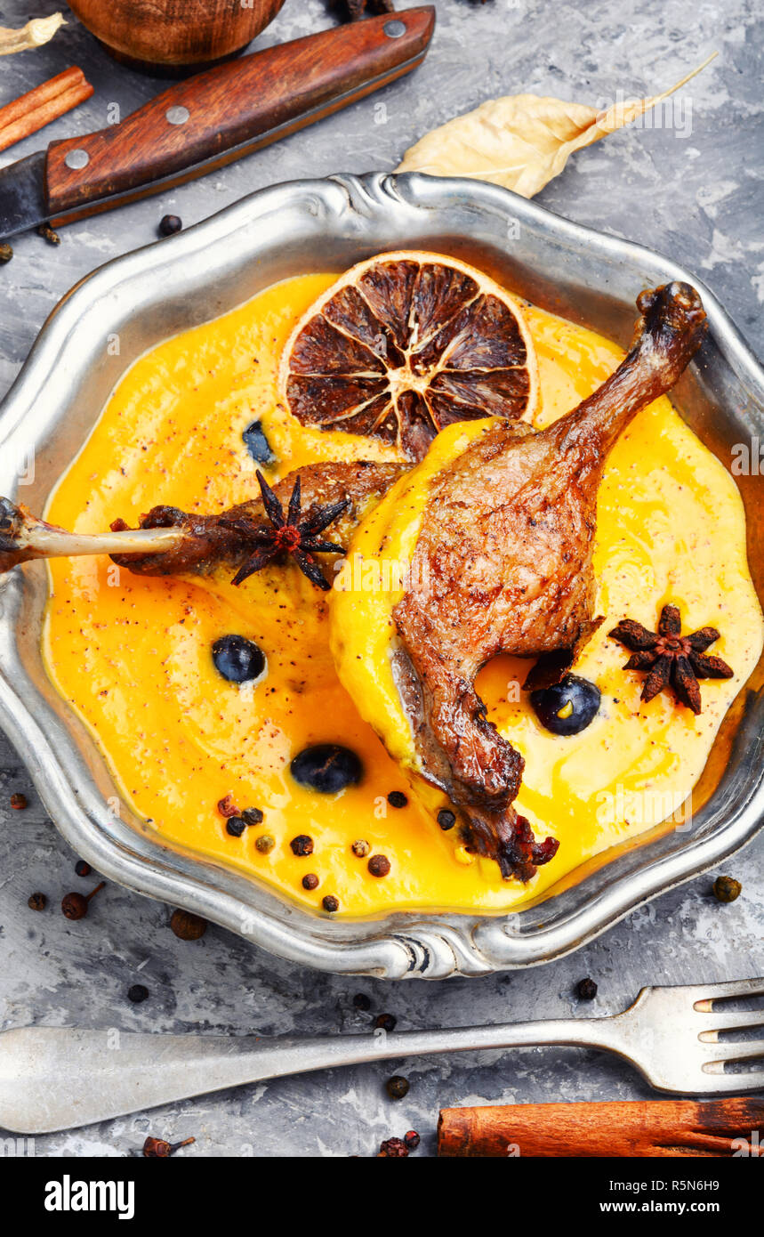 Grilled duck legs baked in pumpkin puree.Dietary meat.Italian food