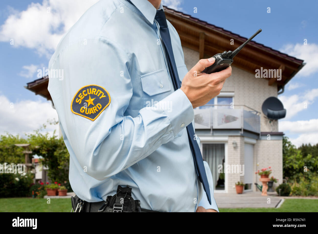 Security Guard Holding Walkie Talkie Stock Photo Alamy