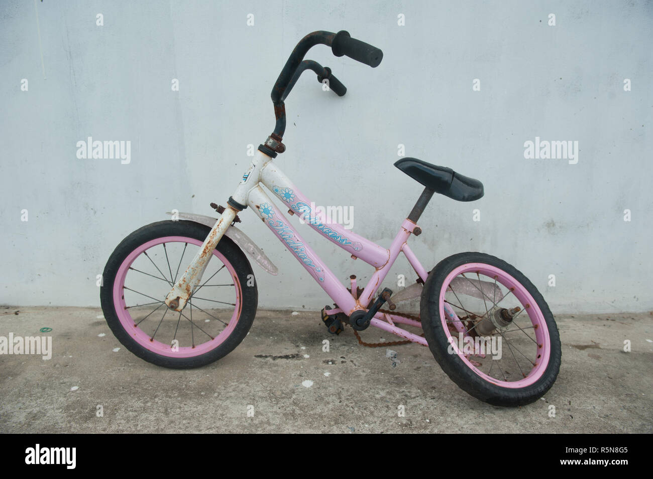 A broken rear wheel kid bicycle Stock Photo