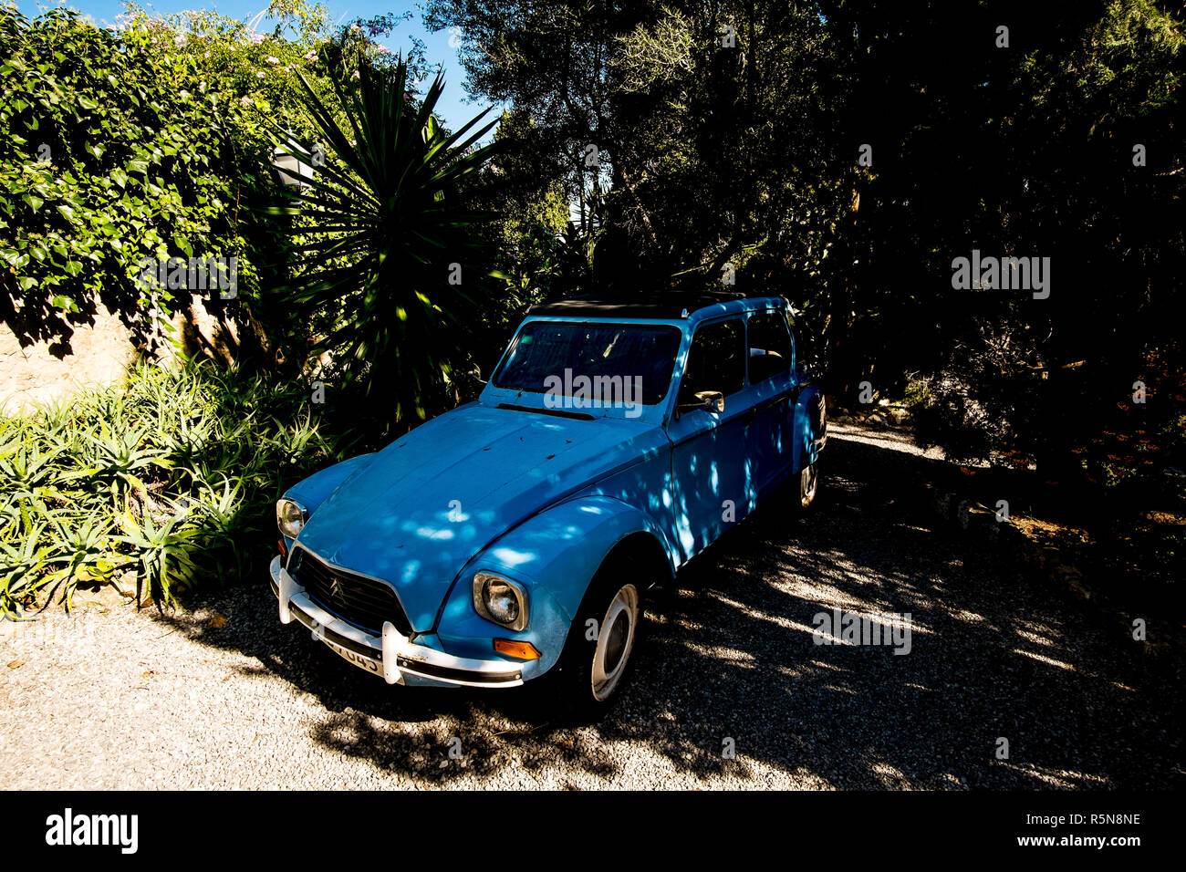 A blue Citroen Dyane car parked near the top of the Carrer del Calvari in Pollenca, Mallorca Stock Photo