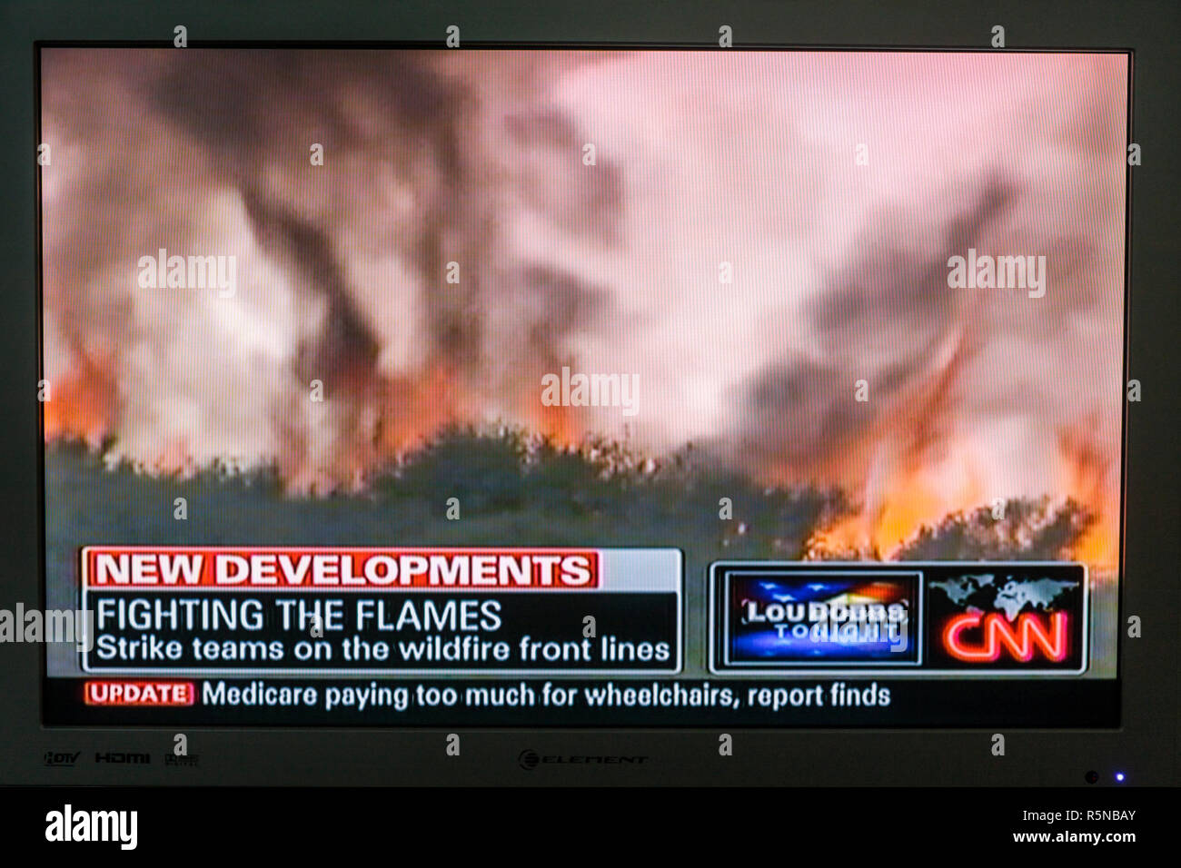 TV television,set screen news newscast,CNN Cable News Network,wildfires wildfire disaster disasters,out of control fire fires strike team teams front Stock Photo