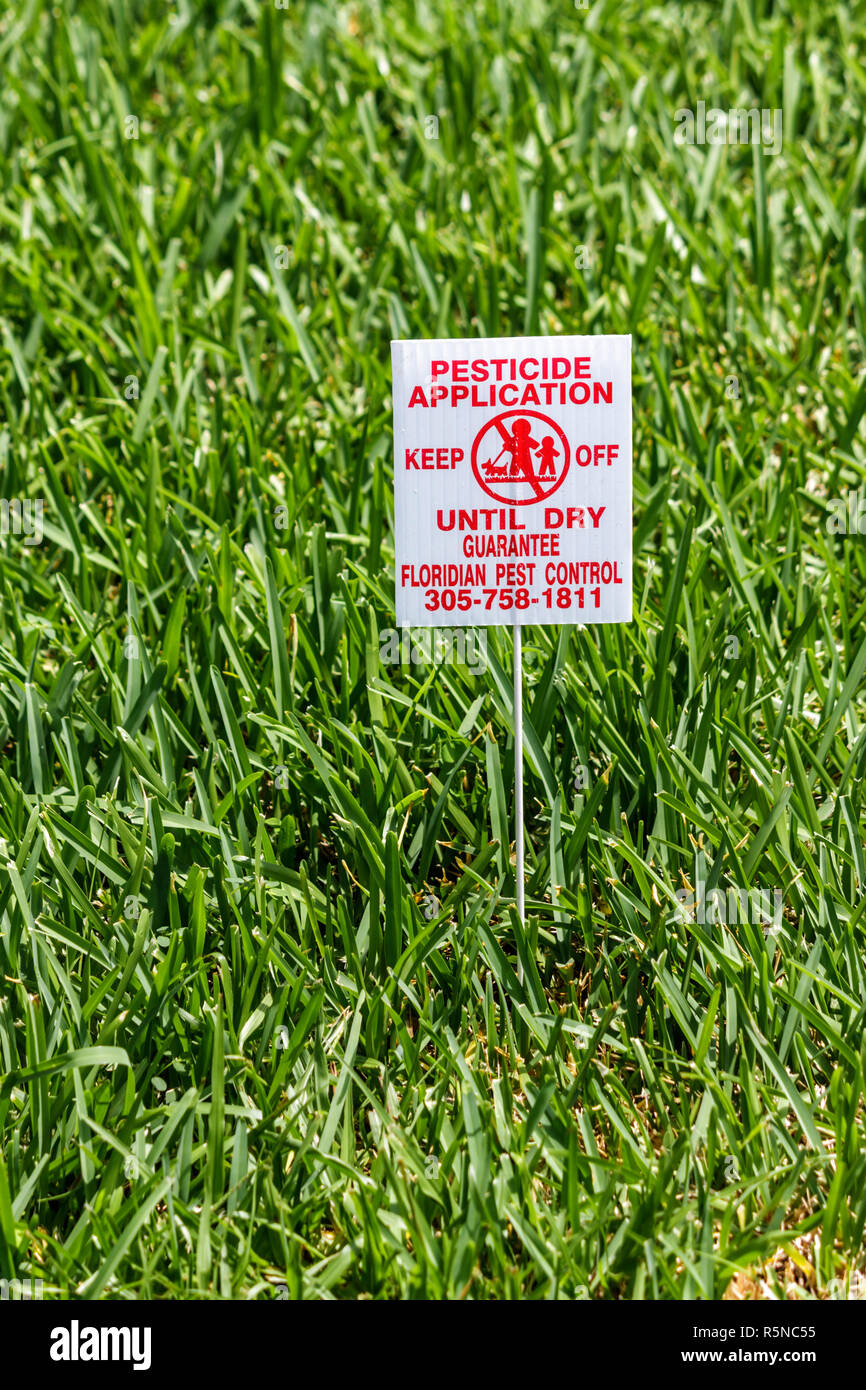 Miami Beach Florida,residential,lawn,sign,warning,pesticide application,pest control,keep off,pet,child,safety,chemicals,FL090912132 Stock Photo