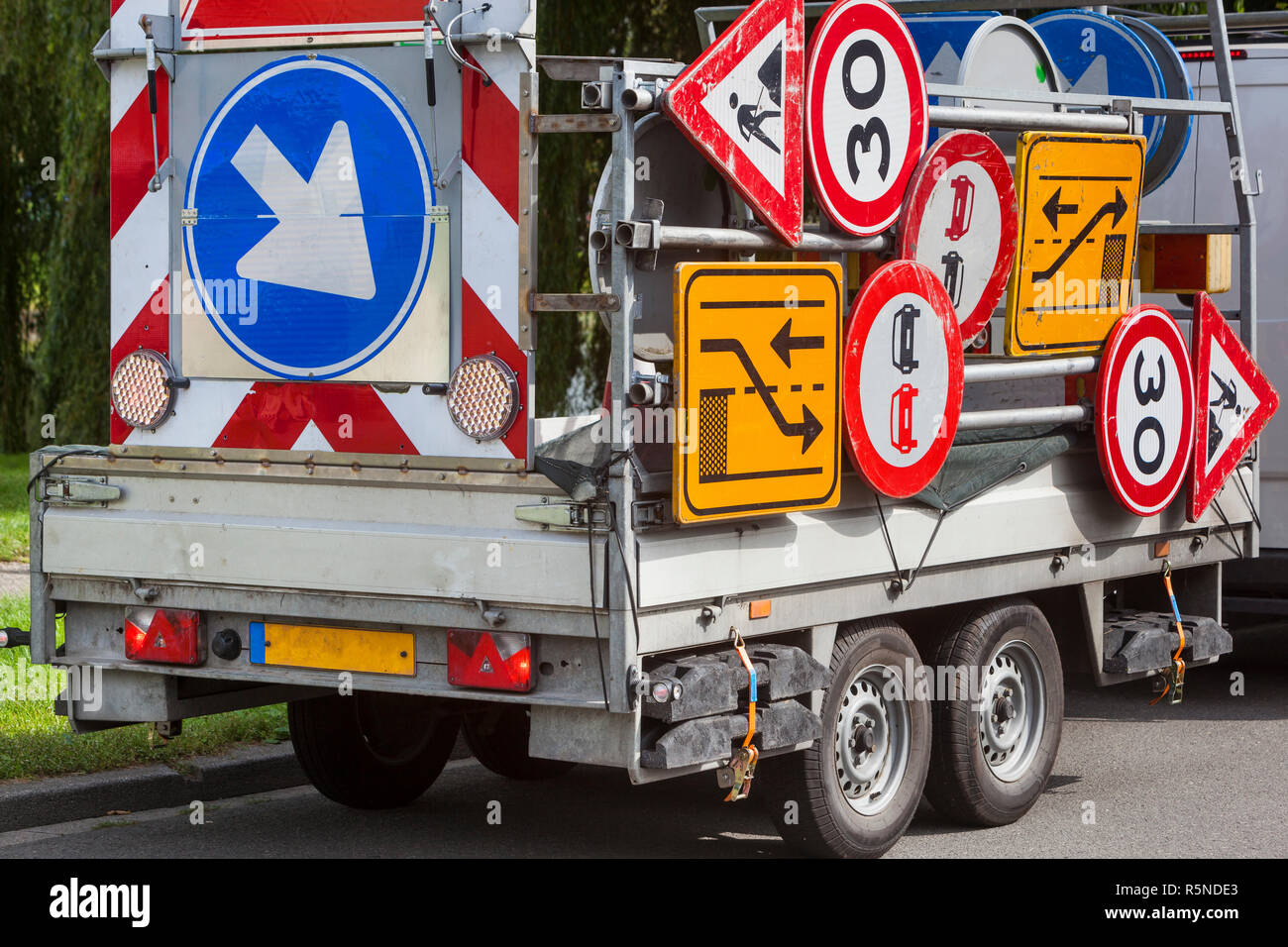 Confusing traffic signs on a trailer Stock Photo - Alamy