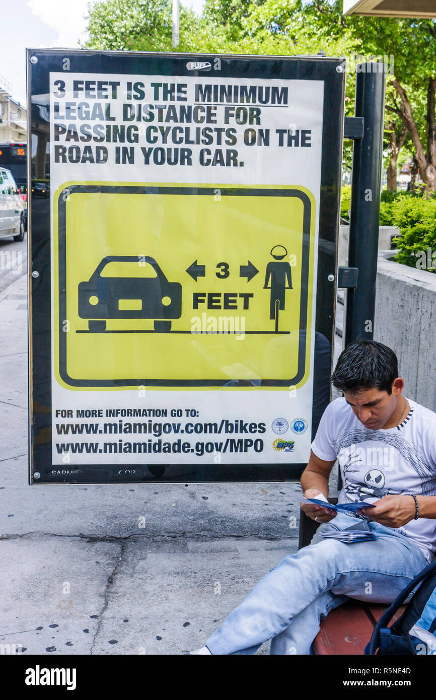 Miami Florida,NW 12th Avenue,bus stop billboard,advertisement,ad,ad,PSA,public service,bicycle safety,passing cyclists,information,legal distance,diag Stock Photo