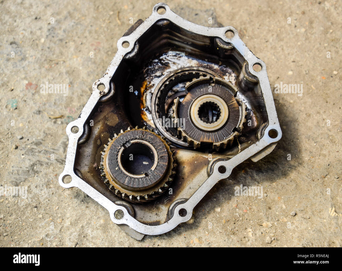 Dismantled box car transmissions. The gears on the shaft of a mechanical transmission. Stock Photo