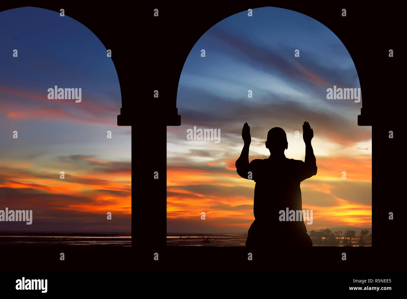 Image silhouette man praying mosque hi-res stock photography and images ...