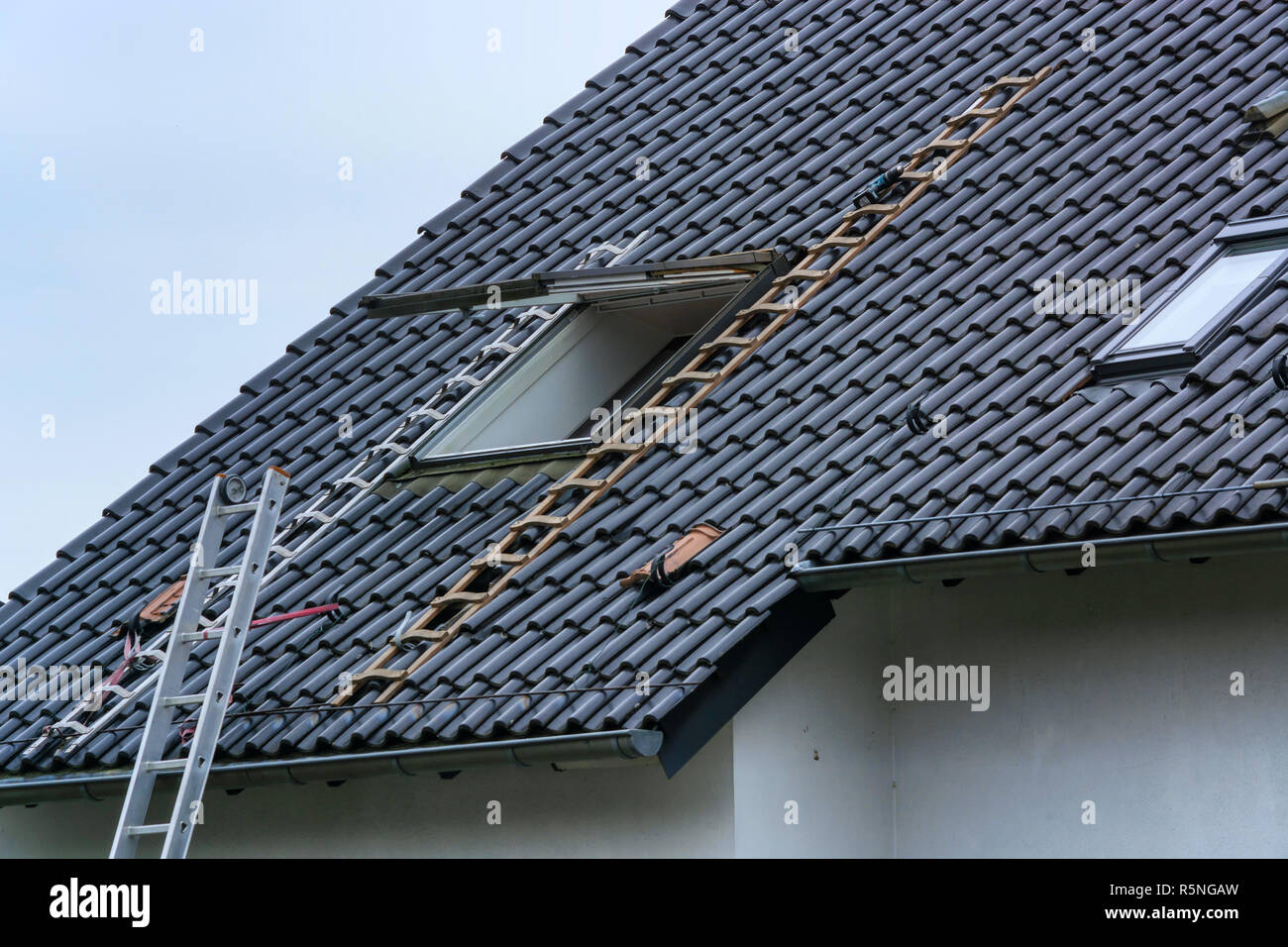 roofer builds in roof windows Stock Photo