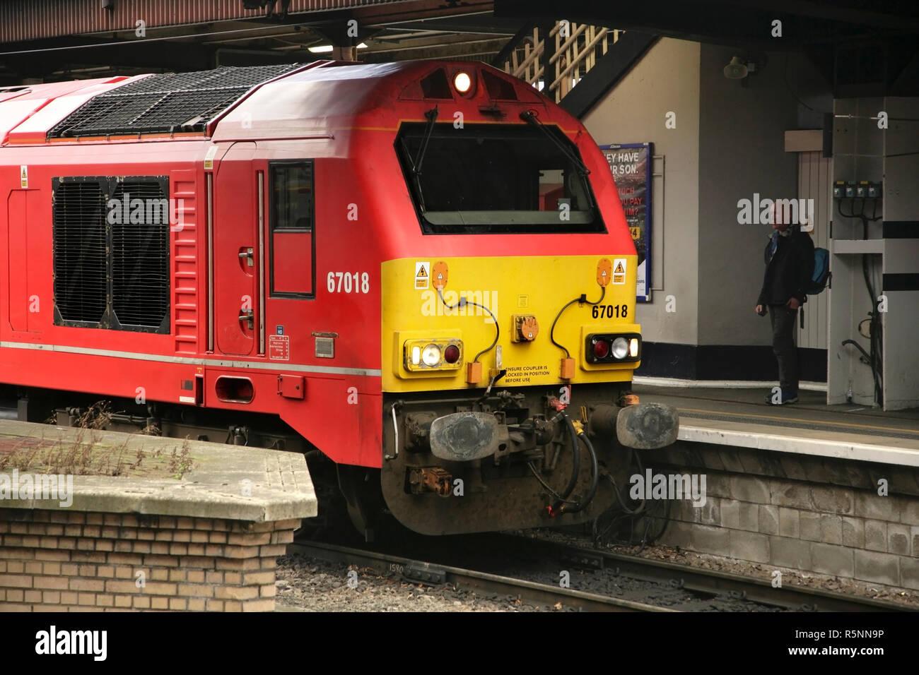 DB Schenker class 67 locomotive 67018 'Keith Heller' hauling a Linlithgow - York railtour into York station, UK. Stock Photo