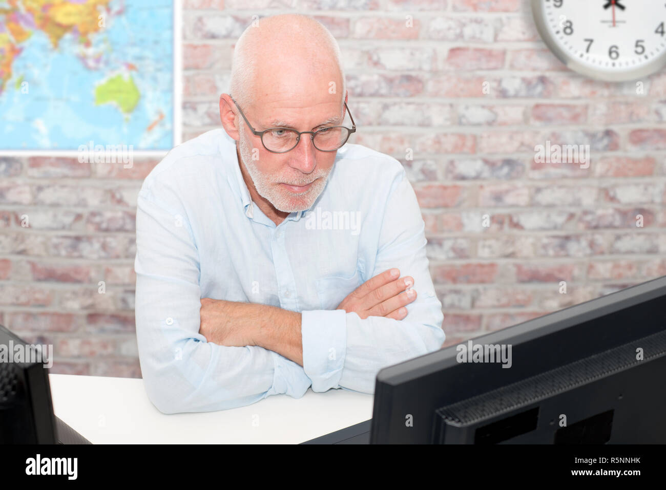 Man With Glasses Using Computer Businessman with glasses using computer Stock Photo - Alamy