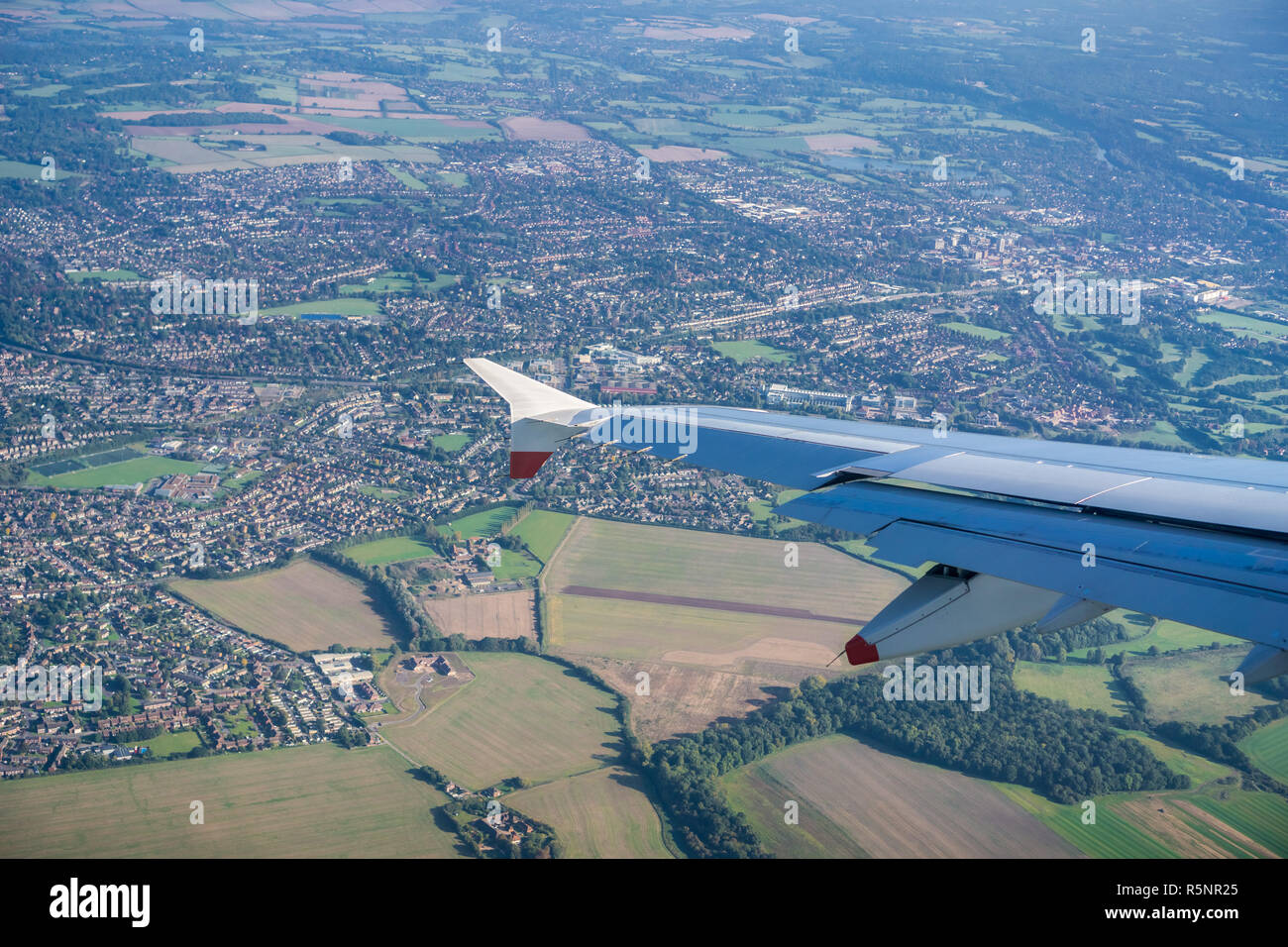 Window view of flying over the British countryside near London, United Kingdom Stock Photo