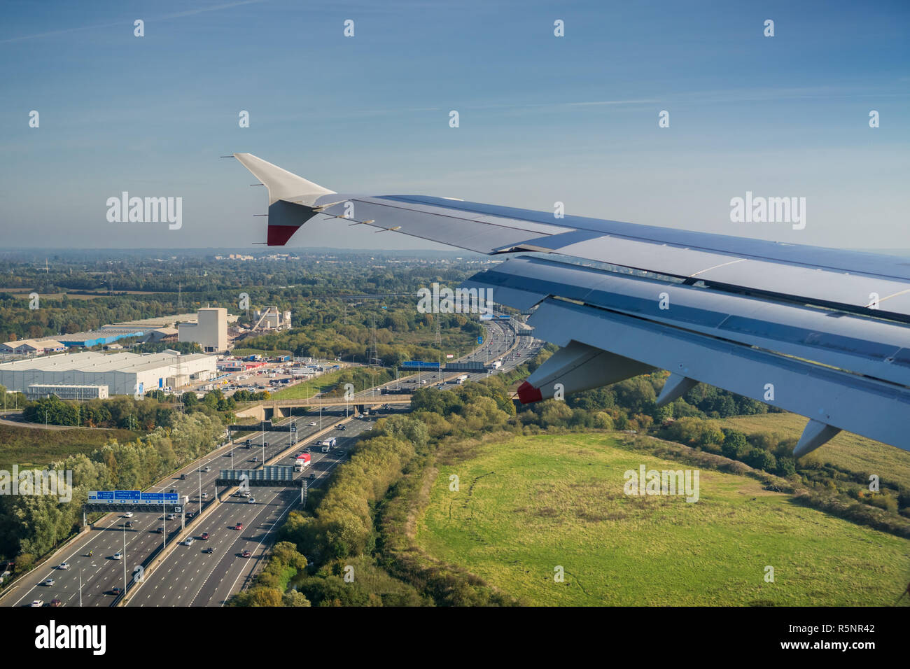 Window view of flying over the highway near Heathrow airport, London, United Kingdom Stock Photo