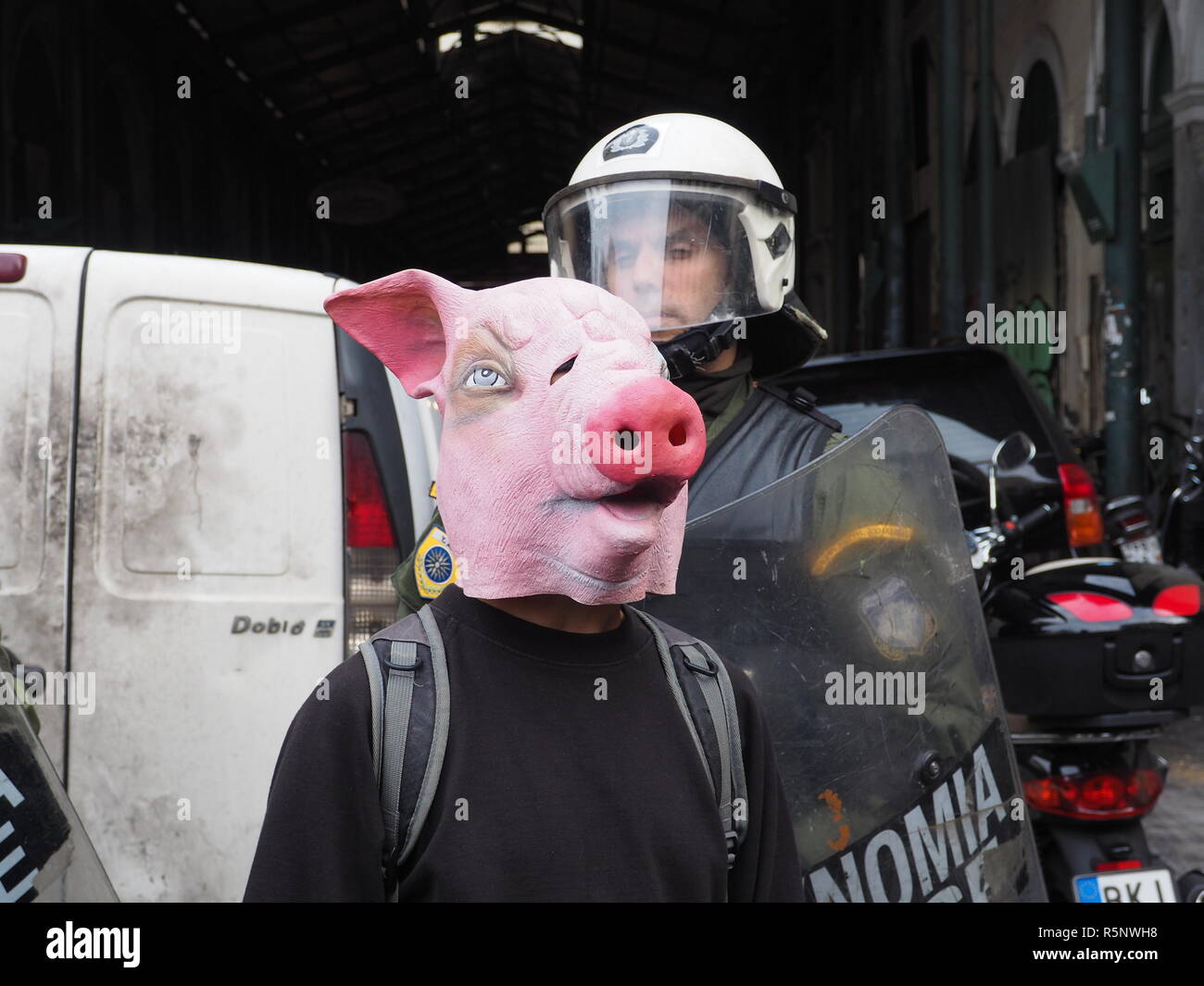 Athens, Greece. 01st Dec, 2018. A demonstrator wearing a pig mask ...