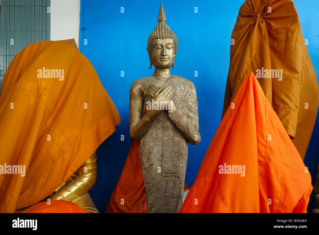 A Buddha statue outside a Buddha factory in Bangkok, Thailand, displaying the hand mudra (gesture) of Vajrapradama or unshakeable self-confidence Stock Photo