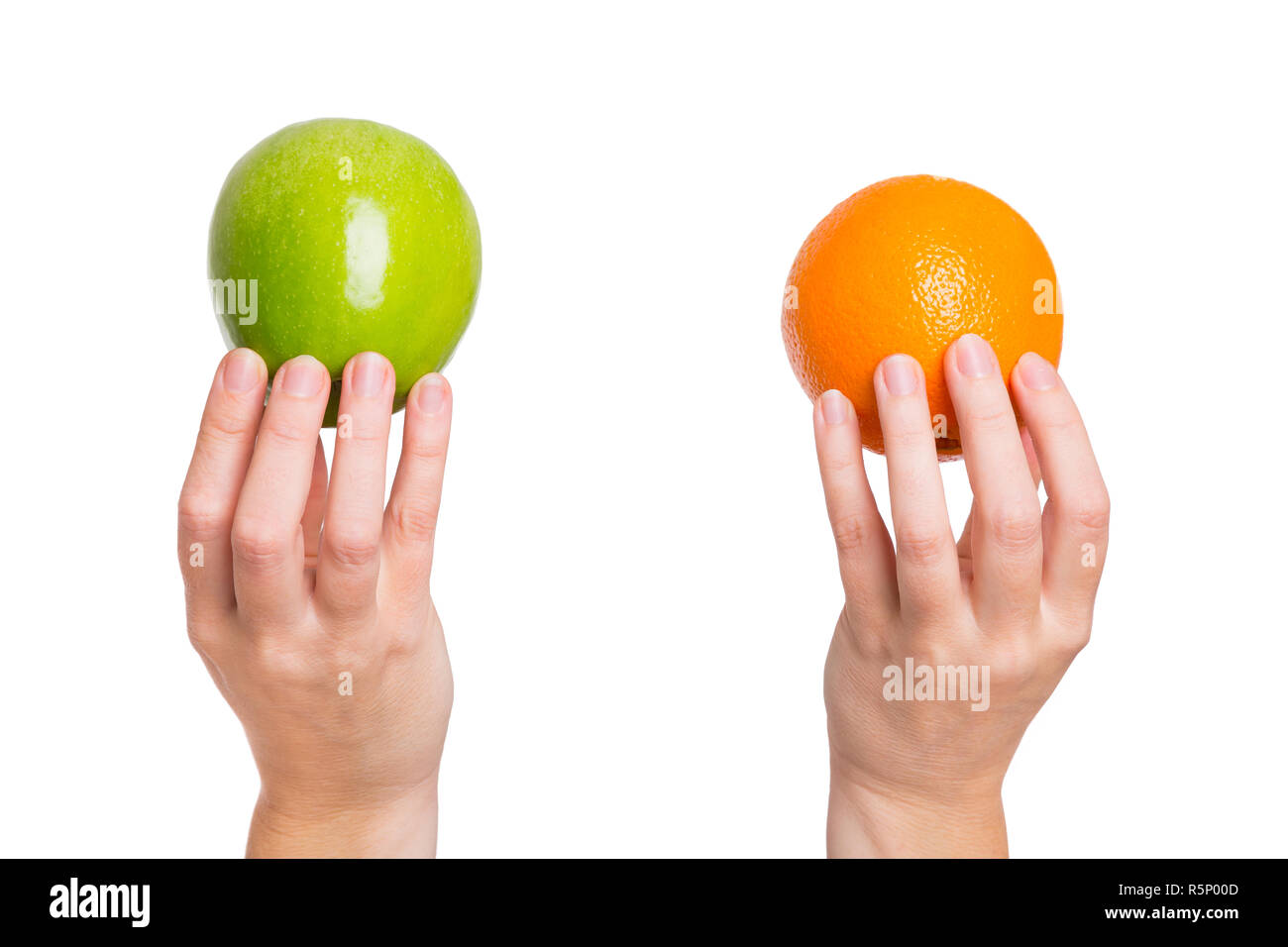 Compare apples with oranges Stock Photo