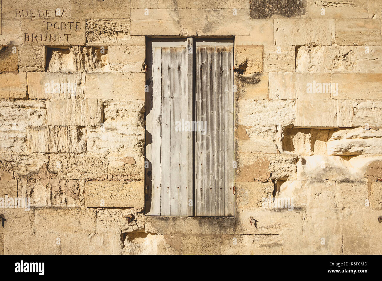 very old stone wall with wooden shutters Stock Photo - Alamy
