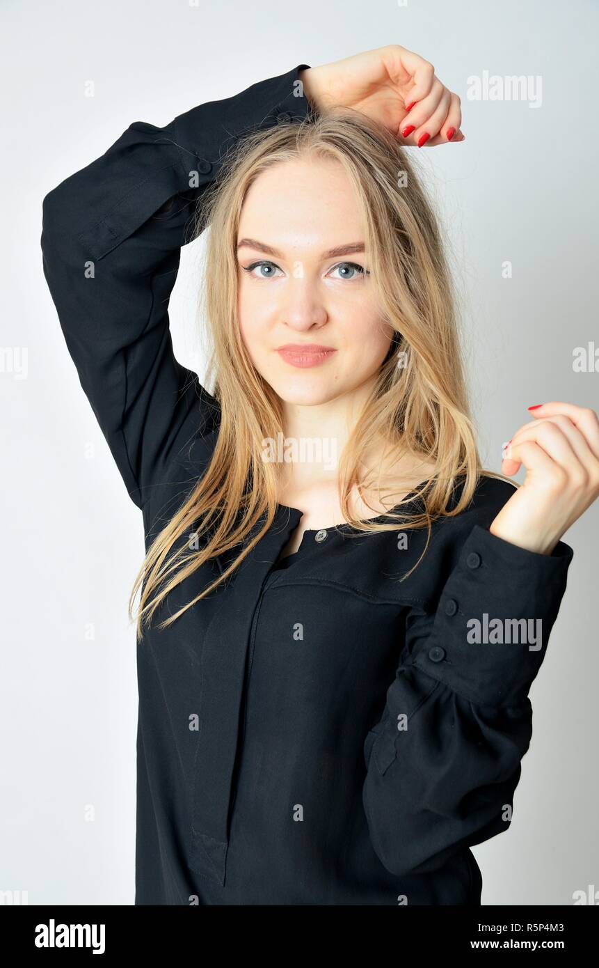 Young female model from Ukraine wearing black top. Portraits made in studio with white background. Stock Photo
