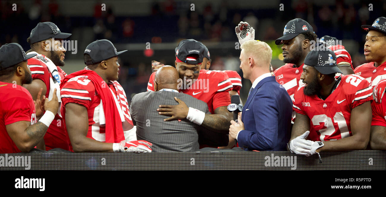accepts MVP trophy from Archie Griffin 