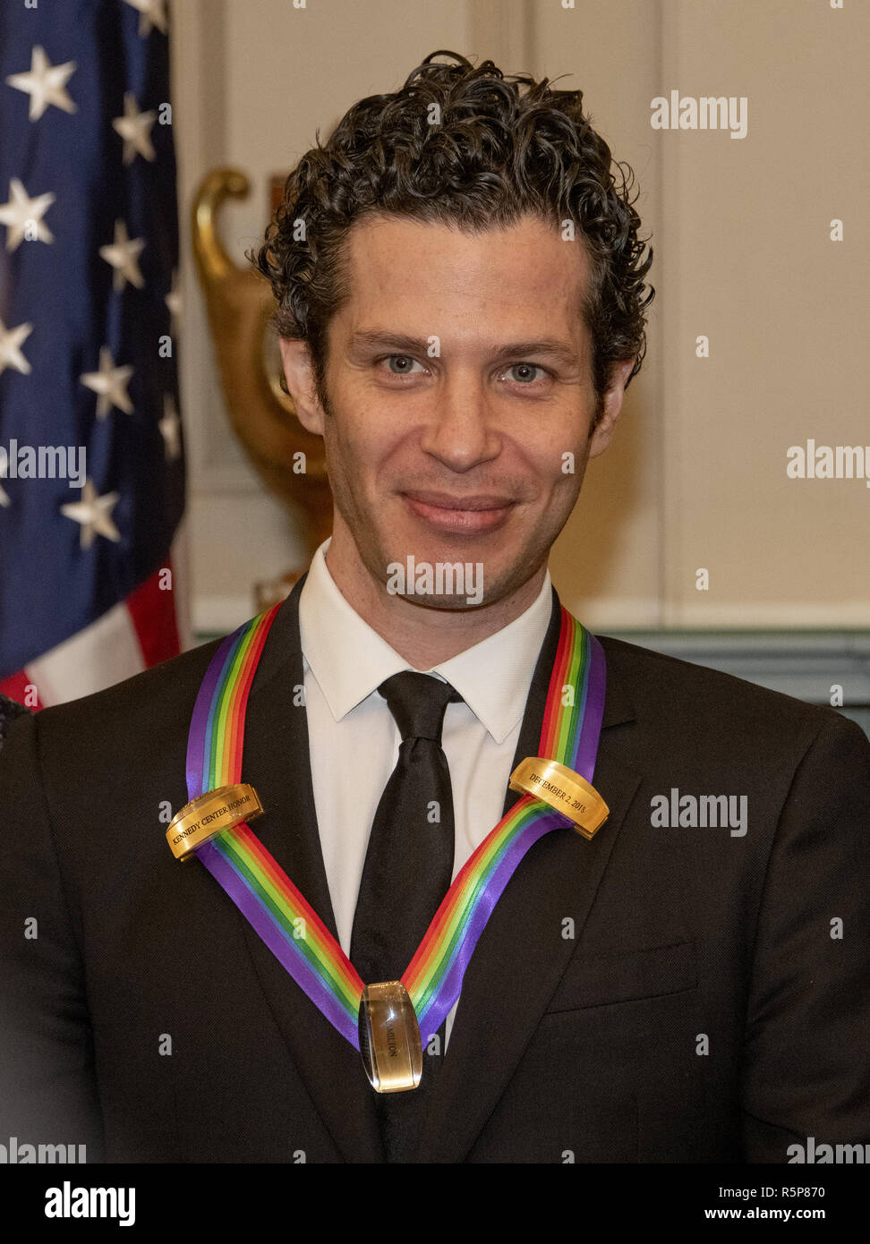 December 1, 2018 - Washington, District of Columbia, U.S. - Thomas Kail, one of the special honorees for Groundbreaking Work on Hamilton, as he poses with the recipients of the 41st Annual Kennedy Center Honors pose for a group photo following a dinner hosted by United States Deputy Secretary of State John J. Sullivan in their honor at the US Department of State in Washington, DC on Saturday, December 1, 2018. The 2018 honorees are: singer and actress Cher; composer and pianist Philip Glass; Country music entertainer Reba McEntire; and jazz saxophonist and composer Wayne Shorter. This year, Stock Photo