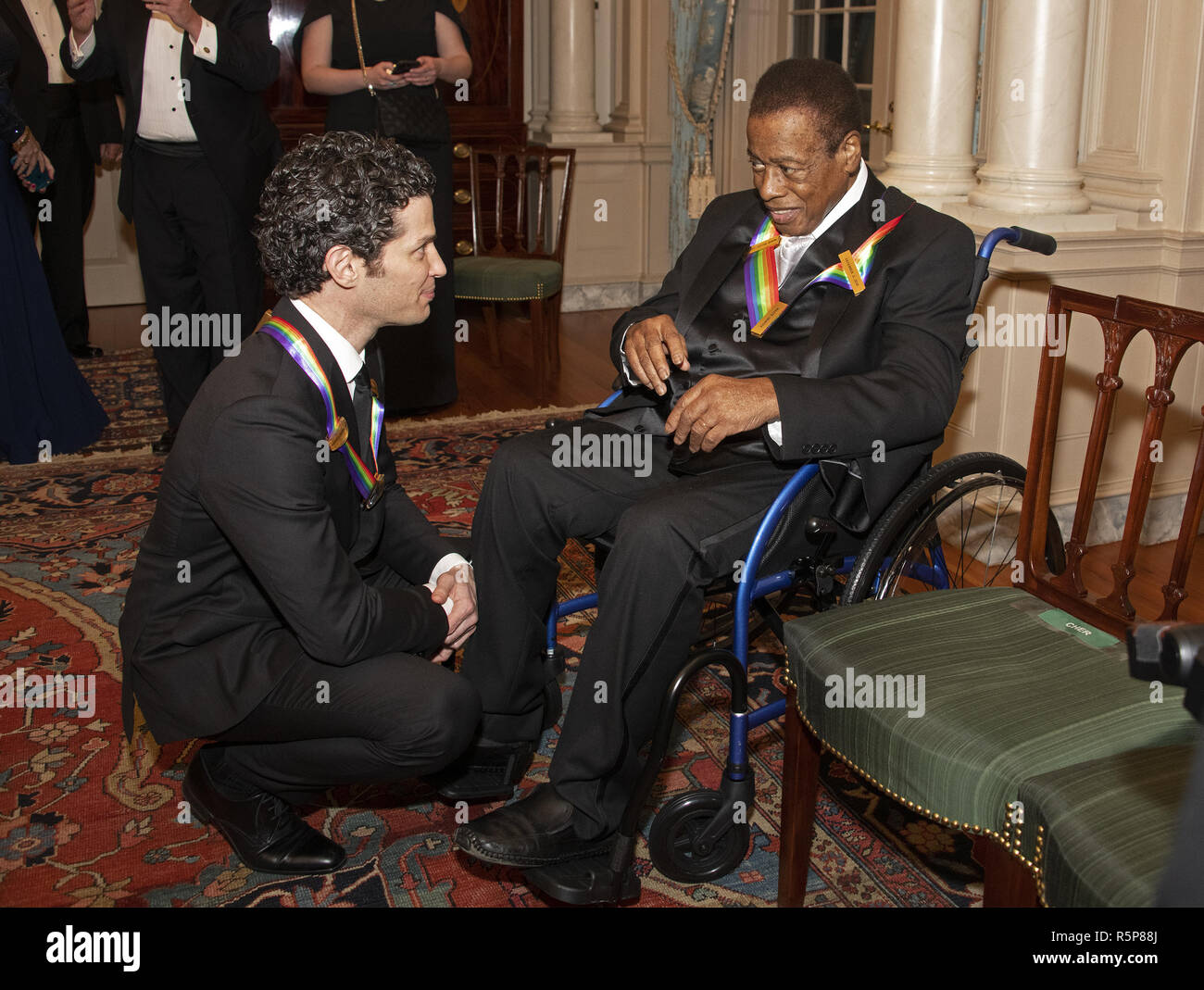 December 1, 2018 - Washington, District of Columbia, U.S. - Thomas Kail, left, and wayne Shorter, right, two of the recipients of the 41st Annual Kennedy Center Honors, converse after posing for a group photo following a dinner hosted by United States Deputy Secretary of State John J. Sullivan in their honor at the US Department of State in Washington, DC on Saturday, December 1, 2018. The 2018 honorees are: singer and actress Cher; composer and pianist Philip Glass; Country music entertainer Reba McEntire; and jazz saxophonist and composer Wayne Shorter. This year, the co-creators of Hamil Stock Photo