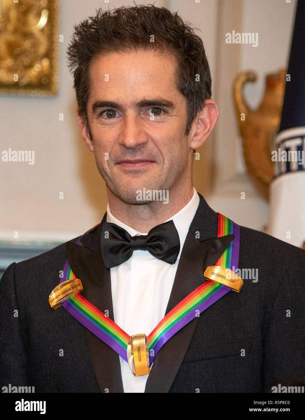 Andy Blankenbuehler, one of the special honorees for Groundbreaking Work on Hamilton, as he poses with the recipients of the 41st Annual Kennedy Center Honors pose for a group photo following a dinner hosted by United States Deputy Secretary of State John J. Sullivan in their honor at the US Department of State in Washington, DC on Saturday, December 1, 2018. The 2018 honorees are: singer and actress Cher; composer and pianist Philip Glass; Country music entertainer Reba McEntire; and jazz saxophonist and composer Wayne Shorter. This year, the co-creators of Hamilton,- writer and actor Lin- Stock Photo