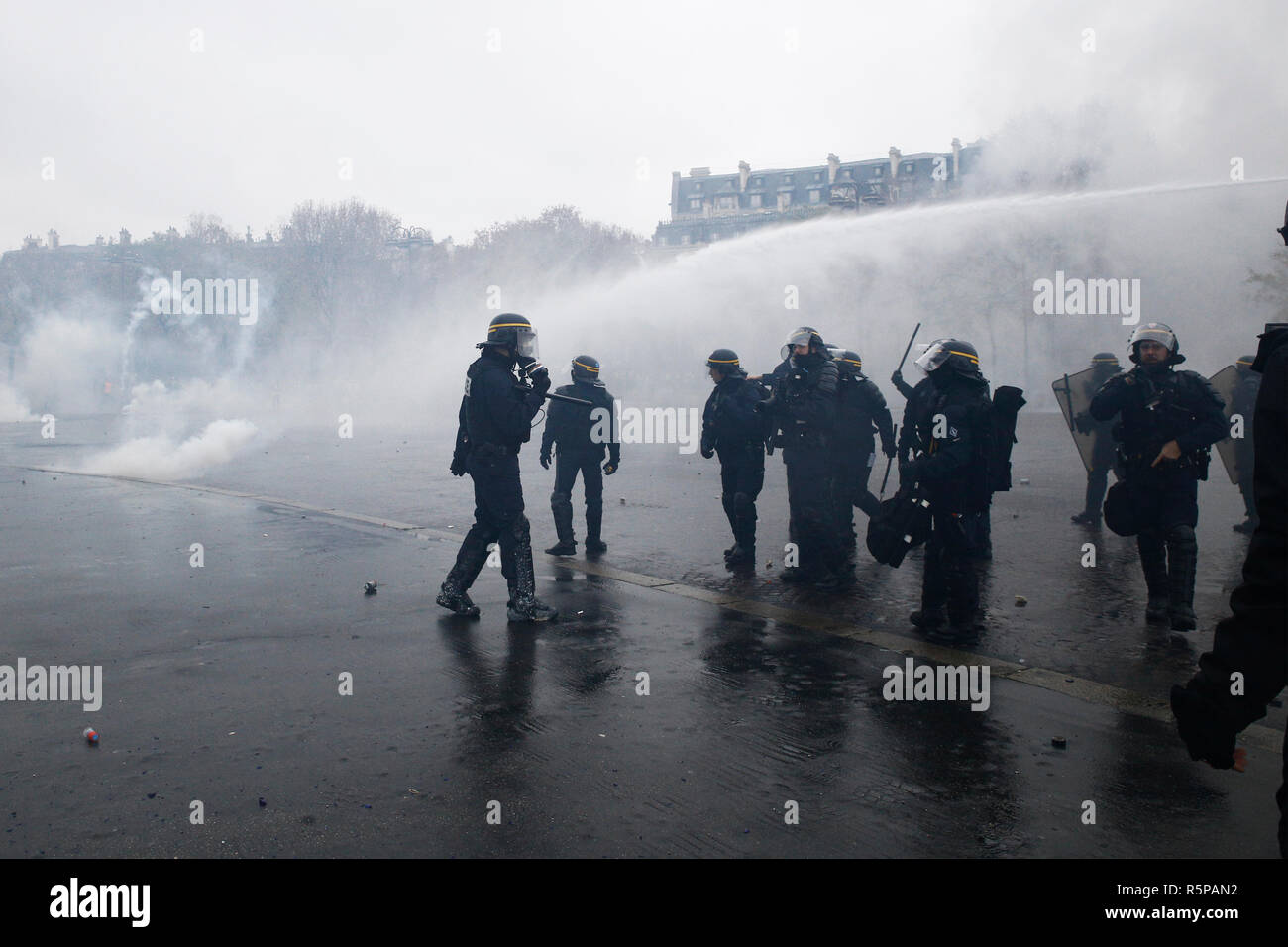 Paris, France. 1st December 2018. Riot Police uses a water canon and ...