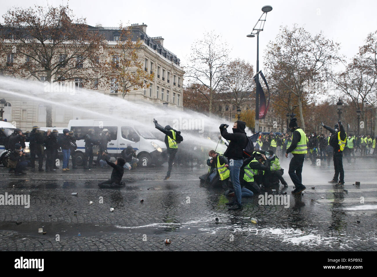 Paris, France. 1st December 2018. Riot Police uses a water canon and ...
