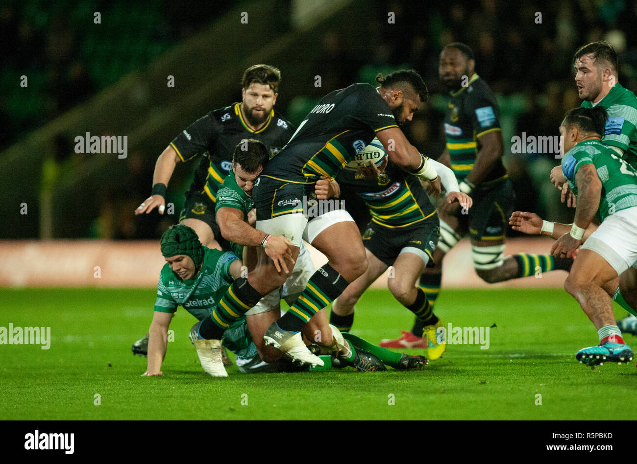 Northampton, UK. 1st December 2018. Taqele Naiyaravoro of Northampton Saints is tackled by John Hardie during the Gallagher Premiership Rugby match between Northampton Saints and Newcastle Falcons. Andrew Taylor/Alamy Live News Stock Photo