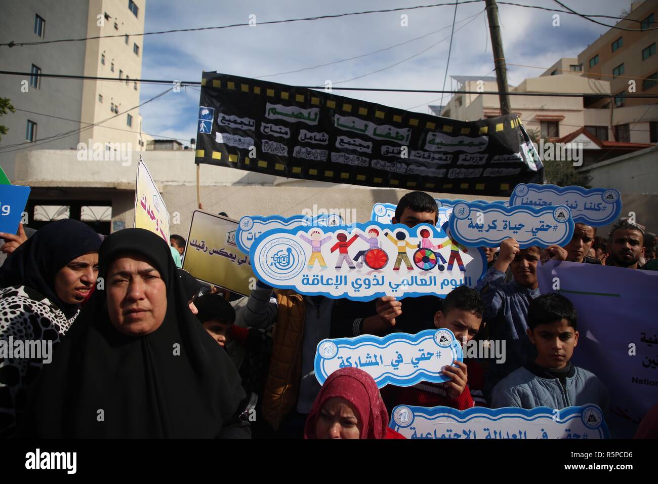 Gaza City, The Gaza Strip, Palestine. 2nd Dec, 2018. Disabled Palestinians take part taking part in rally in front of the UN quarter in Gaza city demanding the protection of disabled rights. Credit: Hassan Jedi/Quds Net News/ZUMA Wire/Alamy Live News Stock Photo