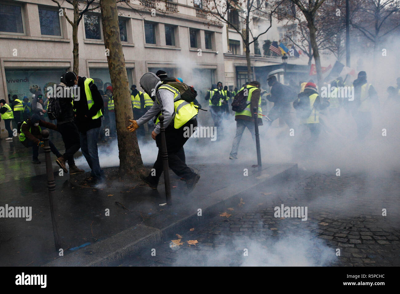 Paris, France. 1st December 2018. Riot Police uses a water canon and ...