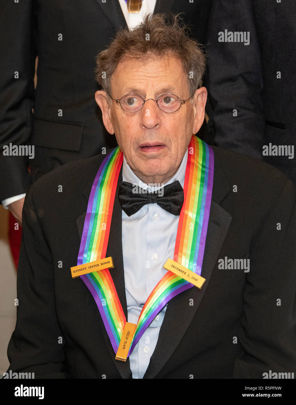 Washington, USA. 1st Dec 2018. Philip Glass, one of the recipients of the 41st Annual Kennedy Center Honors, as he poses for a group photo following a dinner hosted by United States Deputy Secretary of State John J. Sullivan in their honor at the US Department of State in Washington, DC on Saturday, December 1, 2018. d Credit: MediaPunch Inc/Alamy Live News Stock Photo