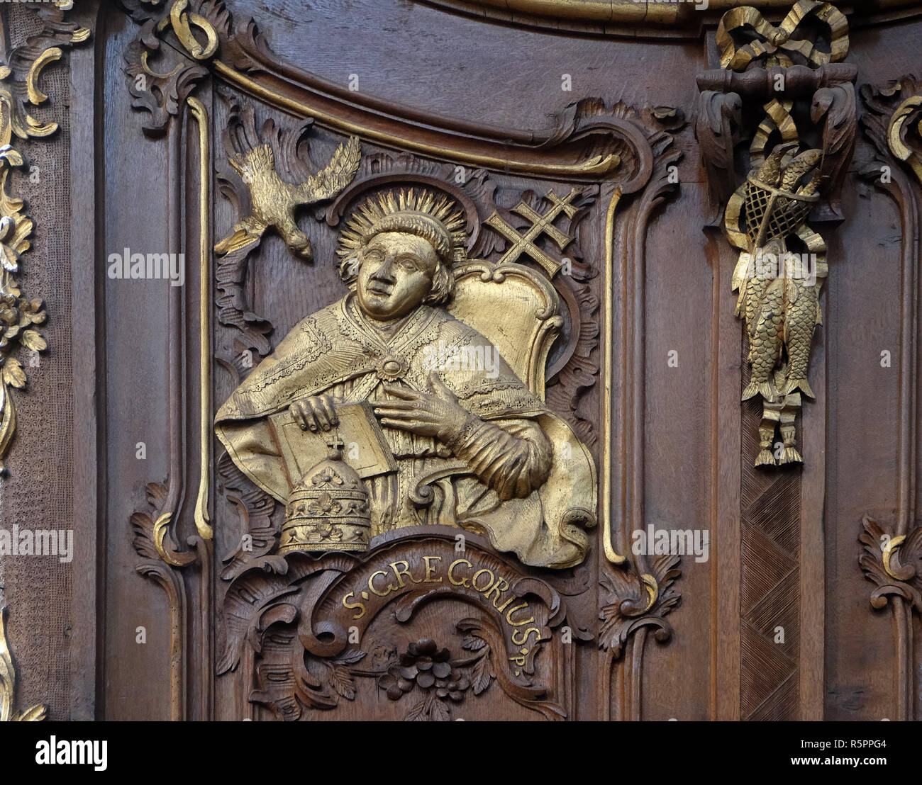 Saint Gregory the Great, one of the Latin Fathers of the Church, choir stalls by Daniel Aschauer in Cistercian Abbey of Bronbach in Reicholzheim near  Stock Photo